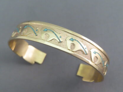 Gold Bracelet with Bears by Robert Taylor