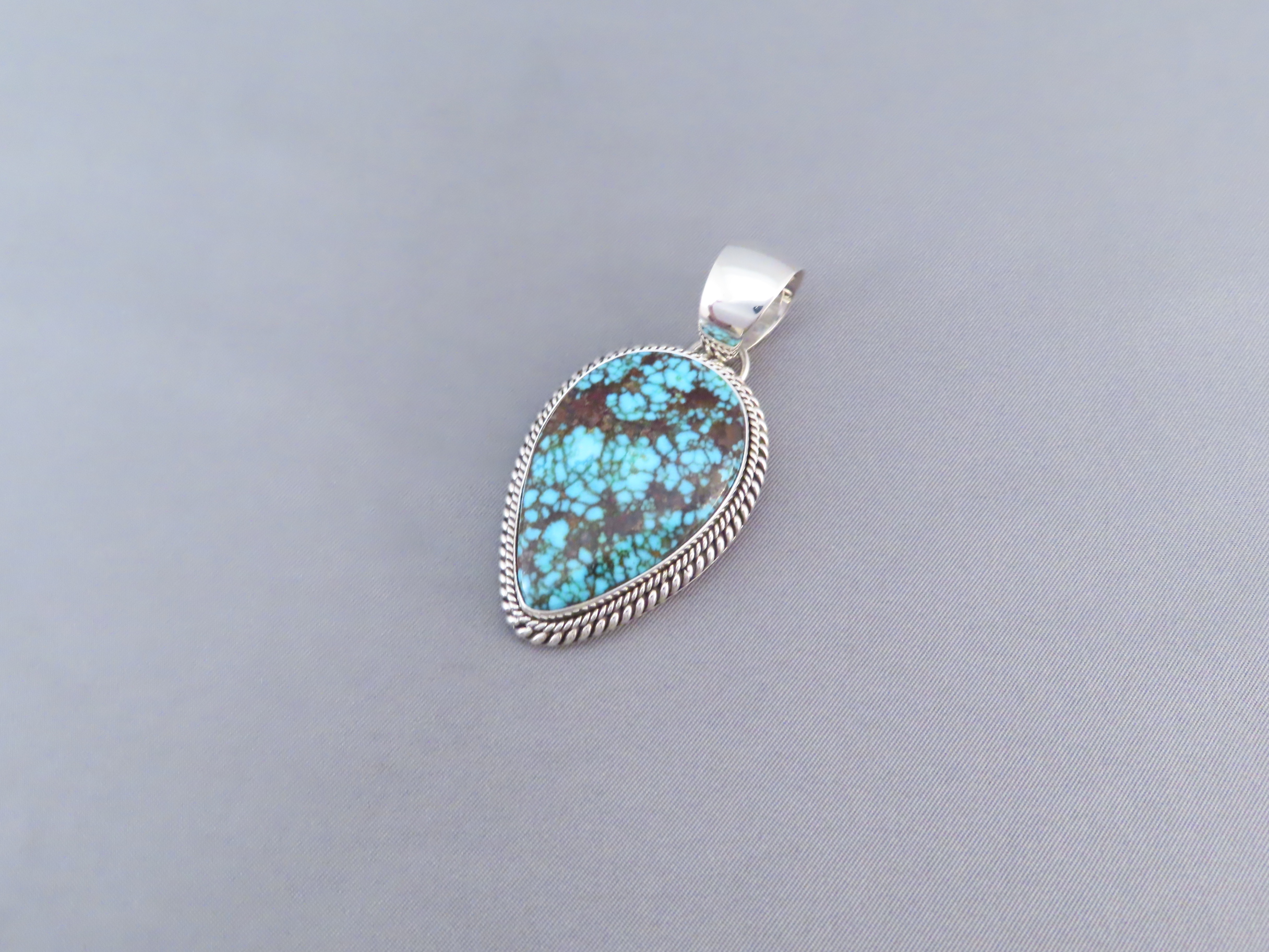 Kingman Turquoise Pendant by Artie Yellowhorse (Navajo)